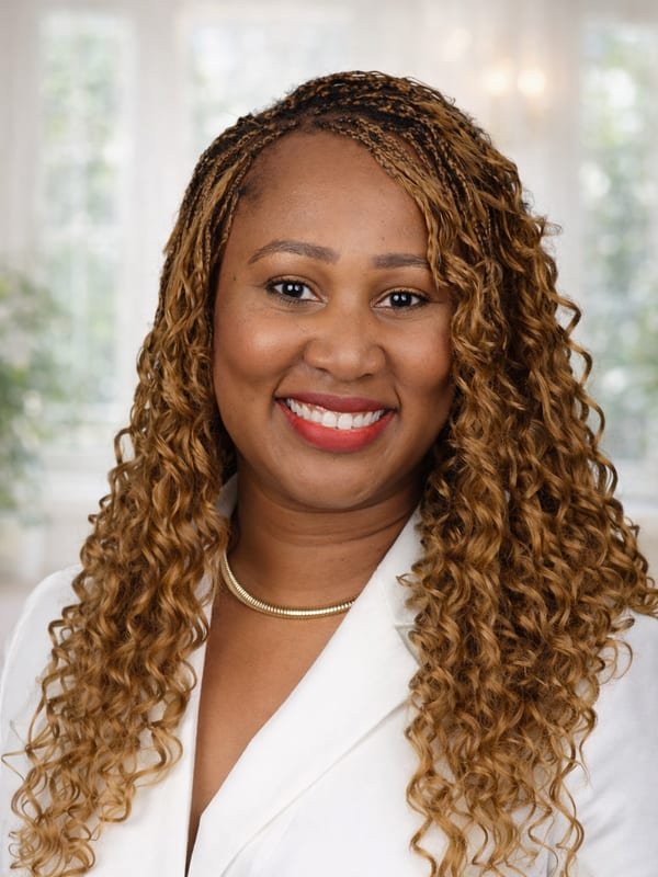 Esther Jackson-Stowell speaking at a real estate conference